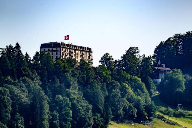 This photograph shows a part of the Burgenstock luxury hotel complex above Lake Lucerne, where talks following up on a deal to end the Middle East conflict were scheduled to begin, on June 19, 2026. Switzerland announced on June 19, 2026 that planned talks following up on the deal to end the Middle East war had been postponed, hours after US Vice President JD Vance's departure for the Alpine country was cancelled. (Photo by Fabrice COFFRINI / AFP)