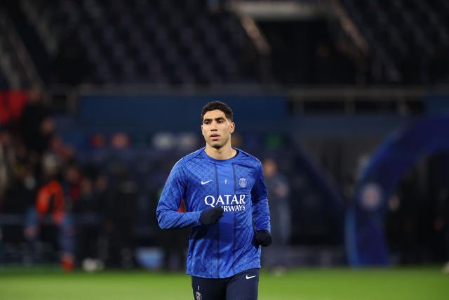(FILES) Paris Saint-Germain's Moroccan defender #02 Achraf Hakimi warms up ahead of the UEFA Champions League play-off second leg football match between Paris Saint-Germain (PSG) and AS Monaco at the Parc des Princes stadium in Paris on February 25, 2026. A French appeals court on June 19, 2026 confirmed Moroccan football star Achraf Hakimi will stand trial charged with raping a young woman. In February 2023, a woman then aged 24 told police in the Val-De-Marne region southeast of Paris that Hakimi had raped her. The Paris Saint-Germain player and captain of the Moroccan national team, whose side are playing their second World Cup match on June 19 against Scotland, has consistently denied the allegations. (Photo by FRANCK FIFE / AFP)