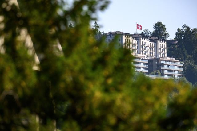 This photograph shows a part of the Burgenstock luxury hotel complex (C) above Lake Lucerne, where talks following up on a deal to end the Middle East conflict were scheduled to begin, on June 19, 2026. Switzerland announced on June 19, 2026 that planned talks following up on the deal to end the Middle East war had been postponed, hours after US Vice President JD Vance's departure for the Alpine country was cancelled. (Photo by Fabrice COFFRINI / AFP)