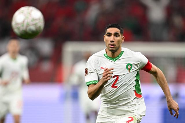 (FILES) Morocco's defender #02 Achraf Hakimi eyes the ball during the Africa Cup of Nations (CAN) quarter-final football match between Cameroon and Morocco at the Prince Moulay Abdallah stadium in Rabat on January 9, 2026. A French appeals court on June 19, 2026 confirmed Moroccan football star Achraf Hakimi will stand trial charged with raping a young woman. In February 2023, a woman then aged 24 told police in the Val-De-Marne region southeast of Paris that Hakimi had raped her. The Paris Saint-Germain player and captain of the Moroccan national team, whose side are playing their second World Cup match on June 19 against Scotland, has consistently denied the allegations. (Photo by Paul ELLIS / AFP)