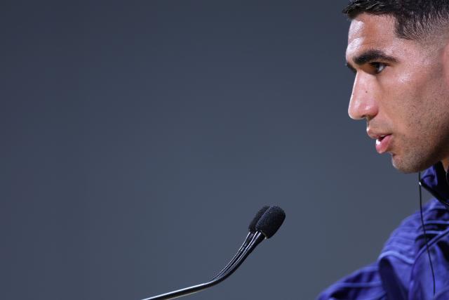 (FILES) Paris Saint-Germain's Moroccan defender #02 Achraf Hakimi speaks during a press conference on the eve of Paris Saint-Germain's second leg semi-final UEFA Champions League match against Arsenal, at the club's training ground in Poissy, west of Paris, on May 6, 2025. A French appeals court on June 19, 2026 confirmed Moroccan football star Achraf Hakimi will stand trial charged with raping a young woman. In February 2023, a woman then aged 24 told police in the Val-De-Marne region southeast of Paris that Hakimi had raped her. The Paris Saint-Germain player and captain of the Moroccan national team, whose side are playing their second World Cup match on June 19 against Scotland, has consistently denied the allegations. (Photo by FRANCK FIFE / AFP)