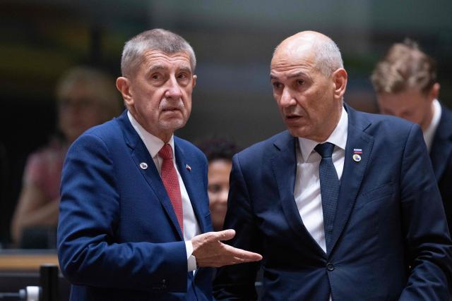 Czech Republic's Prime Minister Andrej Babis (L) and Slovenia's Prime Minister Janez Jansa speak before the start of a round table meeting during the EU Summit at the EU headquarters in Brussels, on June 19, 2026. (Photo by JOHN THYS / AFP)