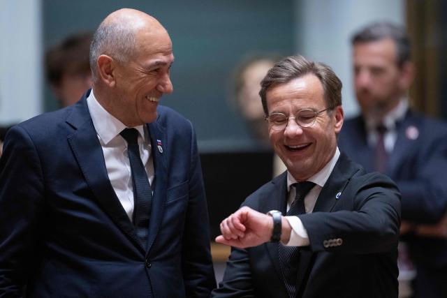 Sweden's Prime Minister Ulf Kristersson (R) and Slovenia's Prime Minister Janez Jansa  speaks prior to a round table meeting during the EU Summit at the EU headquarters in Brussels, on June 19, 2026. (Photo by JOHN THYS / AFP)