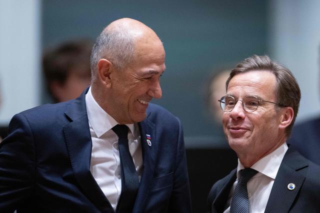 Sweden's Prime Minister Ulf Kristersson (R) and Slovenia's Prime Minister Janez Jansa  speaks prior to a round table meeting during the EU Summit at the EU headquarters in Brussels, on June 19, 2026. (Photo by JOHN THYS / AFP)