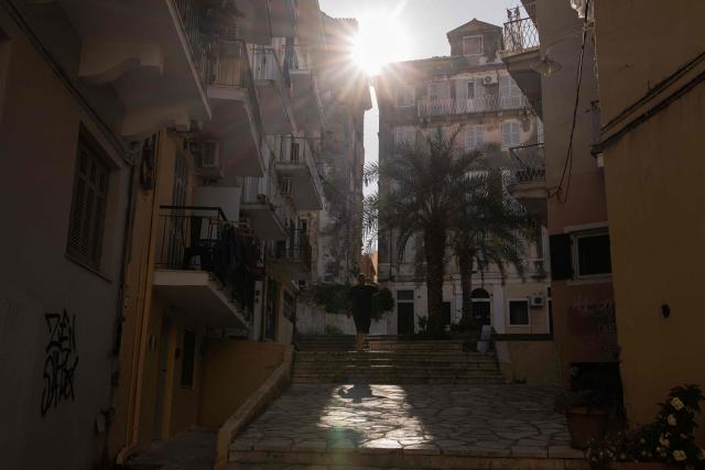 A man walks the streets of the old town of Corfu, on the Greek island of Corfu on June 17, 2026. (Photo by Roman PILIPEY / AFP)