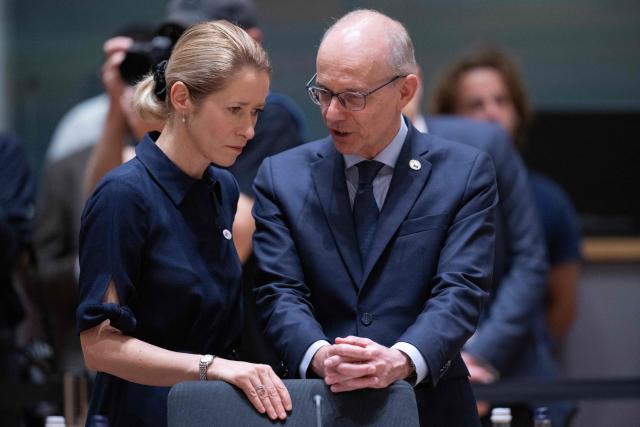 Luxembourg's Prime Minister Luc Frieden speaks with EU High Representative and Vice-President for Foreign Affairs and Security Policy Kaja Kallas (L) before the start of a round table meeting during the EU Summit at the EU headquarters in Brussels, on June 19, 2026. (Photo by JOHN THYS / AFP)