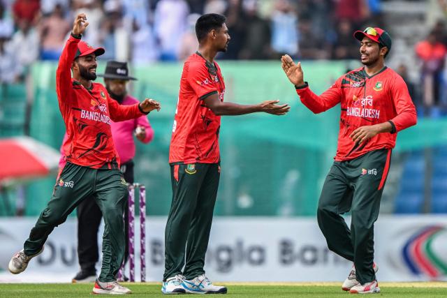 Bangladesh's Mustafizur Rahman (C) celebrates with teammates after taking the wicket of Australia's captain Mitchell Marsh during the second Twenty20 (T20) international cricket match between Bangladesh and Australia at the Bir Sreshtho Flight Lieutenant Matiur Rahman Stadium in Chattogram on June 19, 2026. (Photo by AFP)