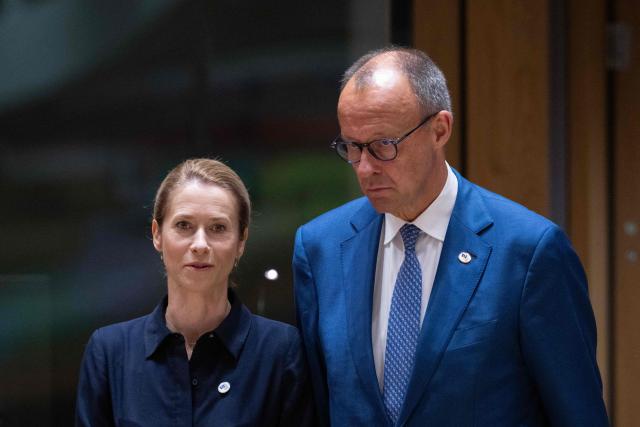EU High Representative and Vice-President for Foreign Affairs and Security Policy Kaja Kallas (L) and Germany's Chancellor Friedrich Merz arrives to attend a round table meeting during the EU Summit at the EU headquarters in Brussels, on June 19, 2026. (Photo by JOHN THYS / AFP)