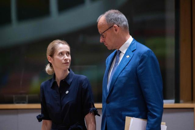 EU High Representative and Vice-President for Foreign Affairs and Security Policy Kaja Kallas (L) and Germany's Chancellor Friedrich Merz arrives to attend a round table meeting during the EU Summit at the EU headquarters in Brussels, on June 19, 2026. (Photo by JOHN THYS / AFP)