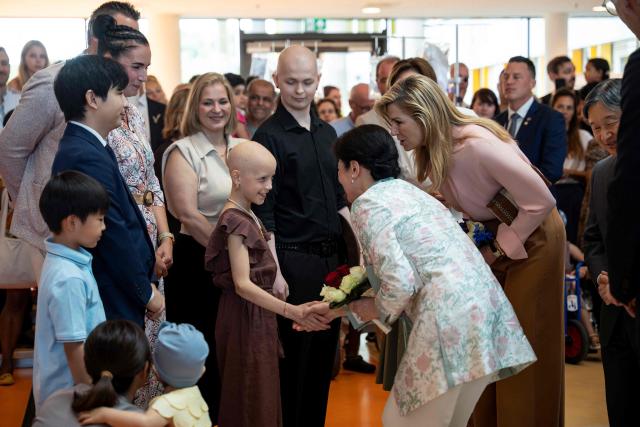Empress Masako of Japan (2nd R) and Queen Maxima of The Netherlands (R) speak to a child during their visit at the Princess Máxima Centre for Pediatric Oncology in Utrecht on June 19, 2026, as part of Japan's imperial couple three-day visit to The Netherlands. (Photo by Lina SELG / AFP)