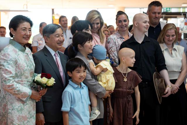 Emperor of Japan Naruhito (2nd L), Empress Masako of Japan (L) and Queen Maxima of The Netherlands (Top-C) pose for a photograph with children during their visit at the Princess Máxima Centre for Pediatric Oncology in Utrecht on June 19, 2026, as part of Japan's imperial couple three-day visit to The Netherlands. (Photo by Lina SELG / AFP)