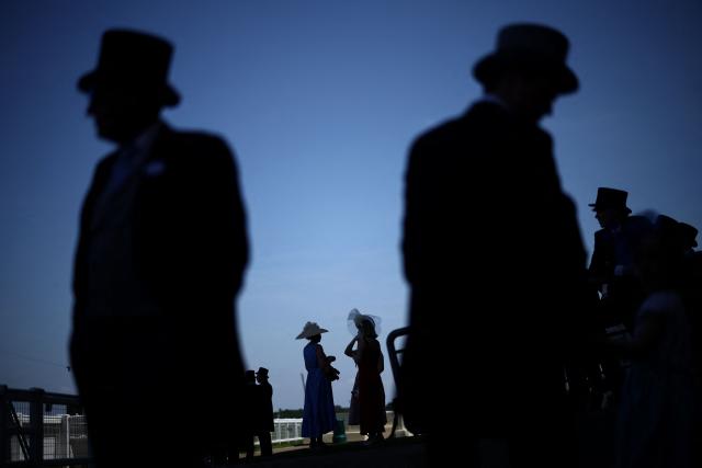 Racegoers attend the fourth day of the Royal Ascot horse racing meeting in Ascot, west of London, on June 19, 2026. (Photo by Henry NICHOLLS / AFP)