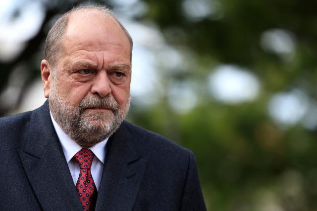 (FILES) Then France's Minister for Justice Eric Dupond-Moretti looks on during a visit to the Parc Imperial High School to launch an "educational boarding school" experiment for challenging pupils in Nice, south-eastern France on April 22, 2024. The verdict in the case of Eric Dupond-Moretti, who was sued for defamation by magistrate Edouard Levrault is scheduled for June 22, 2026. (Photo by Valery HACHE / POOL / AFP)