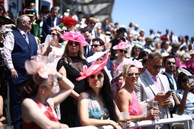 Racegoers wait in the stands on the fourth day of the Royal Ascot horse racing meeting in Ascot, west of London, on June 19, 2026. (Photo by Henry NICHOLLS / AFP)