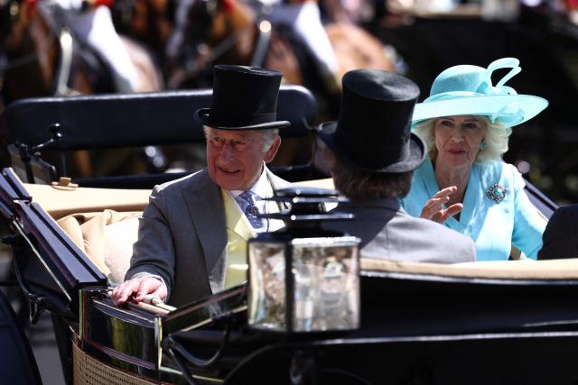 Britain's King Charles III and Britain's Queen Camilla arrive on the fourth day of the Royal Ascot horse racing meeting in Ascot, west of London, on June 19, 2026. (Photo by Henry NICHOLLS / AFP)