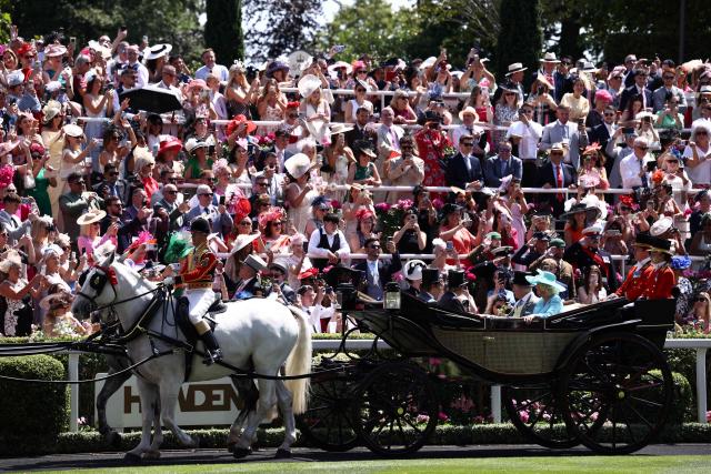 Britain's King Charles III and Britain's Queen Camilla arrive on the fourth day of the Royal Ascot horse racing meeting in Ascot, west of London, on June 19, 2026. (Photo by Henry NICHOLLS / AFP)