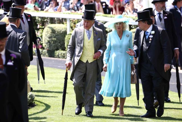 Britain's King Charles III and Britain's Queen Camilla arrive on the fourth day of the Royal Ascot horse racing meeting in Ascot, west of London, on June 19, 2026. (Photo by Henry NICHOLLS / AFP)