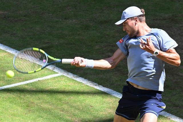 Belgium's Raphael Collignon returns the ball to Germany's Alexander Zverev during their men's singles quarter-final match of the Halle Open ATP tennis tournament in Halle, western Germany, on June 19, 2026. (Photo by CARMEN JASPERSEN / AFP)