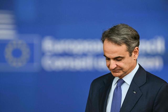 Greece's Prime Minister Kyriakos Mitsotakis arrives for the final press conference during the EU Summit at the EU headquarters in Brussels, on June 19, 2026. (Photo by NICOLAS TUCAT / AFP)