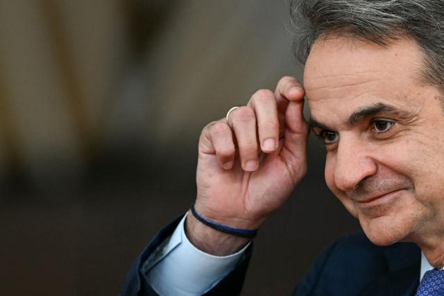 Greece's Prime Minister Kyriakos Mitsotakis arrives for the final press conference during the EU Summit at the EU headquarters in Brussels, on June 19, 2026. (Photo by NICOLAS TUCAT / AFP)