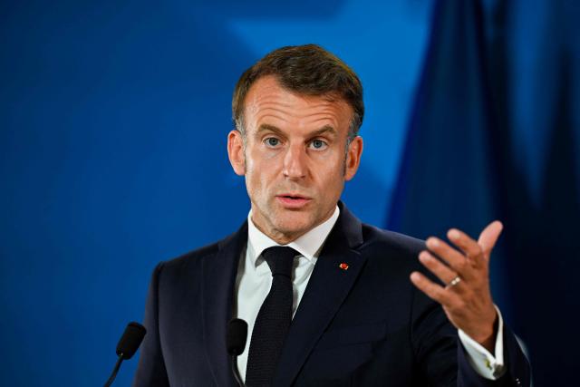 France's President Emmanuel Macron gestures as he speaks during the final press conference as part of the EU Summit at the EU headquarters in Brussels, on June 19, 2026. (Photo by JOHN THYS / AFP)