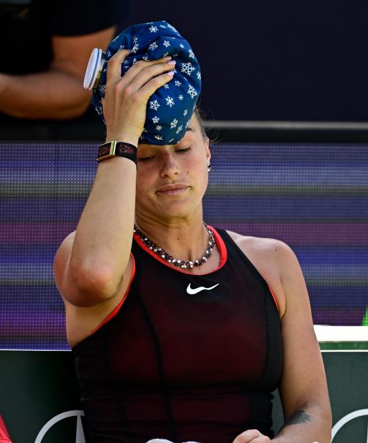 Belarus' Aryna Sabalenka cools herself during her women's singles quarter-final match against Czech Republic's Nikola Bartunkova at the WTA500 Berlin Tennis Open tournament in Berlin on June 19, 2026. (Photo by Tobias SCHWARZ / AFP)