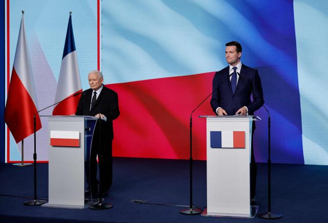 French far-right Rassemblement National (RN) party's President, member of the European Parliament and president of the Patriots for Europe (PfE) group Jordan Bardella (R) and leader of the main opposition right wing Law and Justice (PiS) party Jaroslaw Kaczynski attend a press conference at the party's headquarters in Warsaw on June 19, 2026. Jordan Bardella is on a two day visit to poland meeting with leaders of Polands far right and touring the eastern border, marking the latest stop on his overseas tour aimed at strengthening his European alliances just a few months before the French presidential election. (Photo by Wojtek RADWANSKI / AFP)