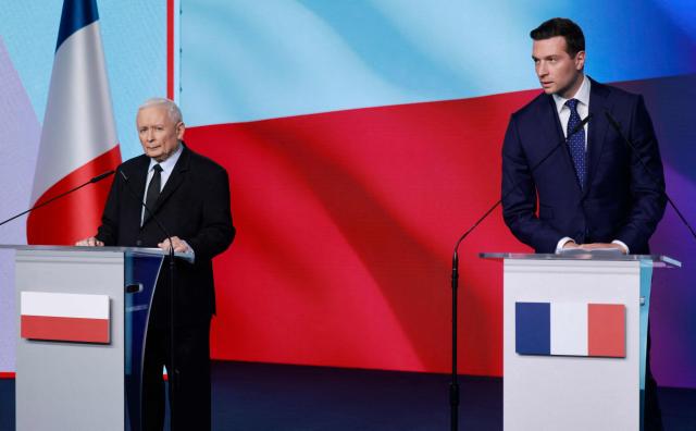 French far-right Rassemblement National (RN) party's President, member of the European Parliament and president of the Patriots for Europe (PfE) group Jordan Bardella (R) and leader of the main opposition right wing Law and Justice (PiS) party Jaroslaw Kaczynski attend a press conference at the party's headquarters in Warsaw on June 19, 2026. Jordan Bardella is on a two day visit to poland meeting with leaders of Polands far right and touring the eastern border, marking the latest stop on his overseas tour aimed at strengthening his European alliances just a few months before the French presidential election. (Photo by Wojtek RADWANSKI / AFP)