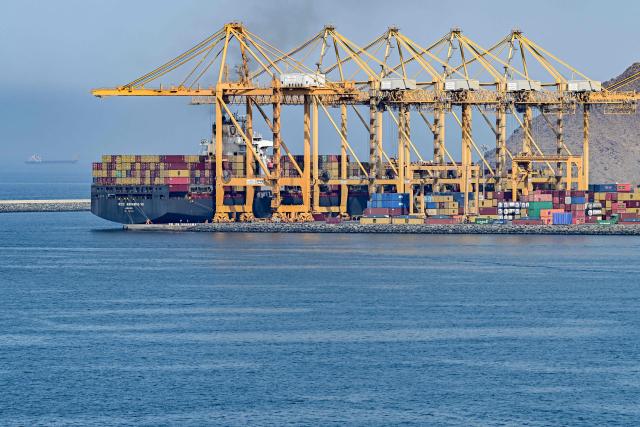 The Cyprus-flagged container vessel MSC Aquarius VII is docked along a pier at the Khor Fakkan Container Terminal, the only natural deep-sea port in the region and one of the major container ports in Sharjah Emirate, along the Gulf of Oman on June 19, 2026. Mediators in the US-Iran conflict, including Pakistan, Saudi Arabia and Turkey, are due to gather for talks in Egypt on June 21. A deal signed earlier in the week by US President Donald Trump and his Iranian counterpart Masoud Pezeshkian, aims to end the conflict that began on February 28 with US-Israeli strikes on Iran. It also provides for the reopening of the Strait of Hormuz and the launch of a 60-day negotiation period on broader issues, including Tehran's nuclear programme. (Photo by AFP) / 