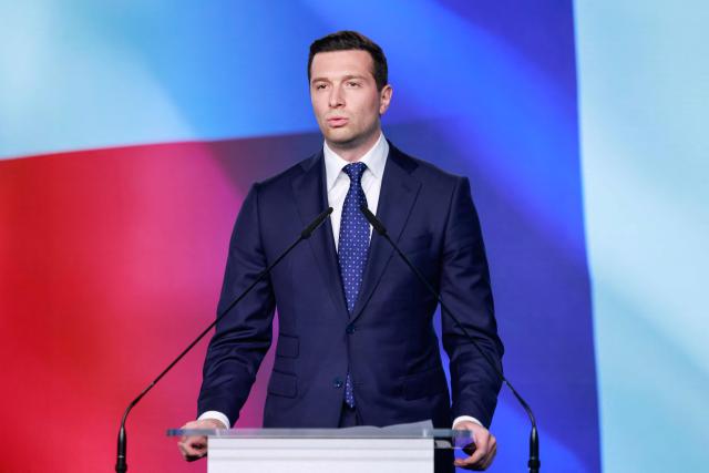 French far-right Rassemblement National (RN) party's President, member of the European Parliament and president of the Patriots for Europe (PfE) group Jordan Bardella attends a joint press conference with the leader of the main opposition right wing Law and Justice (PiS) party at the party's headquarters in Warsaw on June 19, 2026. Jordan Bardella is on a two day visit to poland meeting with leaders of Polands far right and touring the eastern border, marking the latest stop on his overseas tour aimed at strengthening his European alliances just a few months before the French presidential election. (Photo by Wojtek RADWANSKI / AFP)