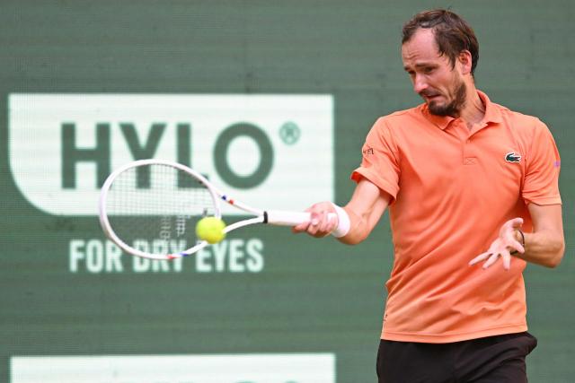 Russia's Daniil Medvedev returns the ball to Germany's Daniel Altmaier during their men's singles quarter-final match of the Halle Open ATP tennis tournament in Halle, western Germany, on June 19, 2026. (Photo by CARMEN JASPERSEN / AFP)