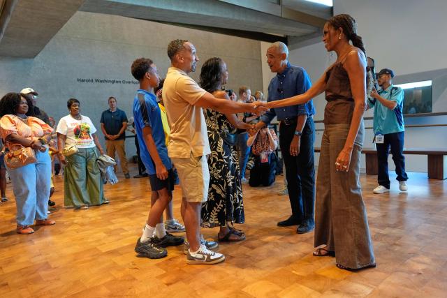 Former US President Barack Obama and former first lady Michelle Obama greet the first group of visitors at the official opening of the Obama Presidential Center in Chicago, Illinois on June 19, 2026. This is the first day the Barack Obama Presidential Center is open to the public. (Photo by Pablo Martinez Monsivais / POOL / AFP)