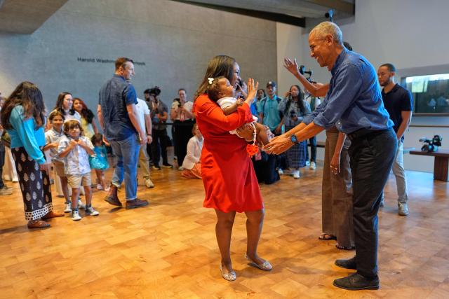 Former US President Barack Obama and former first lady Michelle Obama greet the first group of visitors at the official opening of the Obama Presidential Center in Chicago, Illinois on June 19, 2026. This is the first day the Barack Obama Presidential Center is open to the public. (Photo by Pablo Martinez Monsivais / POOL / AFP)