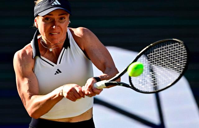 Ukraine's Elina Svitolina returns the ball to the Philippines' Alexandra Eala during the women's singles quarter-final match at the WTA500 Berlin Tennis Open tournament in Berlin on June 19, 2026. (Photo by Tobias SCHWARZ / AFP)