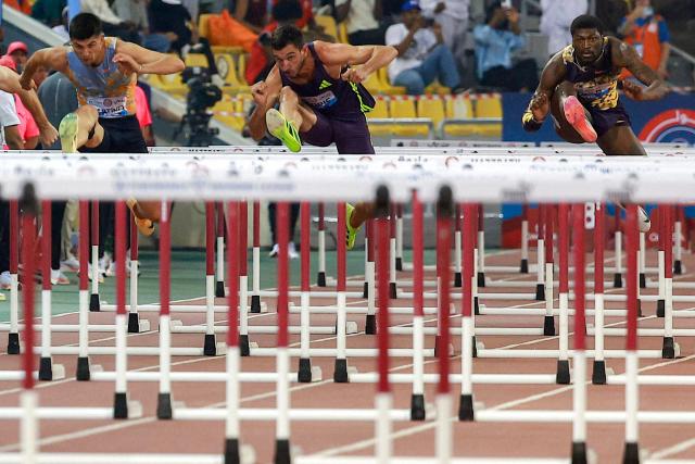 USA's Cordell Tinch competes in the men's 110m hurdles final during the IAAF Diamond League competition at Suheim Bin Hamad Stadium in Doha on June 19, 2026. (Photo by KARIM JAAFAR / AFP)
