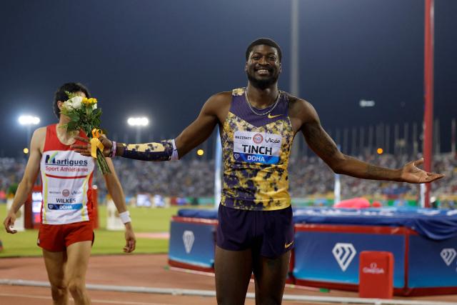 USA's Cordell Tinch celebrates winning the men's 110m hurdles final during the IAAF Diamond League competition at Suheim Bin Hamad Stadium in Doha on June 19, 2026. (Photo by KARIM JAAFAR / AFP)
