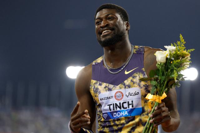 USA's Cordell Tinch celebrates winning the men's 110m hurdles final during the IAAF Diamond League competition at Suheim Bin Hamad Stadium in Doha on June 19, 2026. (Photo by KARIM JAAFAR / AFP)