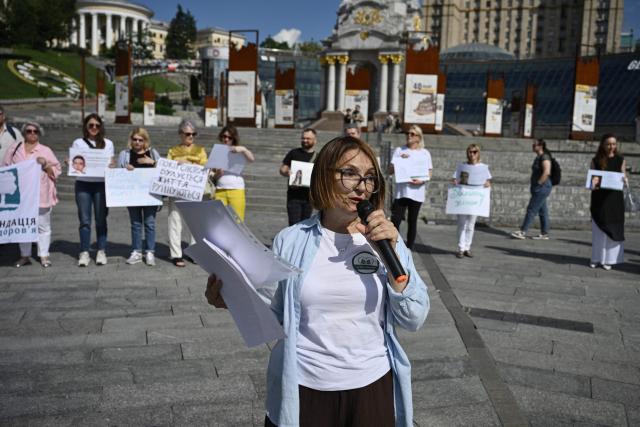 Liudmyla Guseinova, head of the NGO “Numo, sestry!” (Come on, sisters), addresses participants at a meeting marking the International Day for the Elimination of Sexual Violence in Conflict on Independence Square in Kyiv on June 19, 2026, amid the Russian invasion of Ukraine. Several people, mostly women, took part in a demonstration on Kyiv’s central square on June 19, in support of Ukrainian civilian women imprisoned by Russian authorities. (Photo by Genya SAVILOV / AFP)
