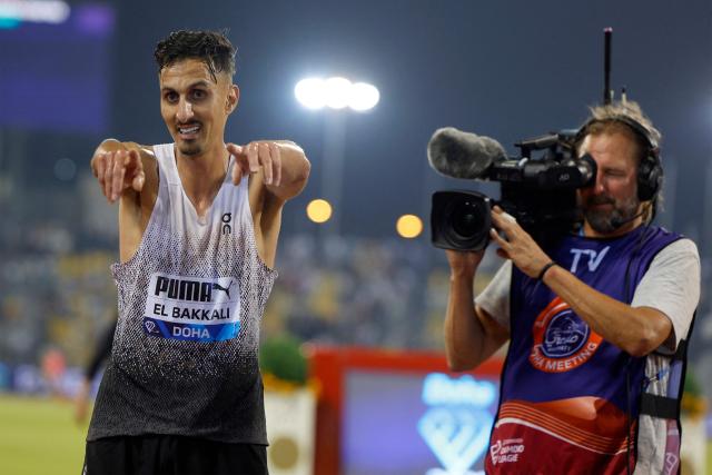 Morocco's Soufiane el-Bakkali celebrates winning the men's 3000m steeplechase final during the IAAF Diamond League competition at Suheim Bin Hamad Stadium in Doha on June 19, 2026. (Photo by KARIM JAAFAR / AFP)