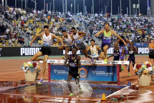 Morocco's Soufiane el-Bakkali competes in the men's 3000m steeplechase final during the IAAF Diamond League competition at Suheim Bin Hamad Stadium in Doha on June 19, 2026. (Photo by KARIM JAAFAR / AFP)