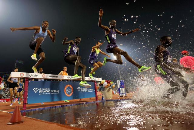 Athletes compete in the men's 3000m steeplechase final during the IAAF Diamond League competition at Suheim Bin Hamad Stadium in Doha on June 19, 2026. (Photo by KARIM JAAFAR / AFP)
