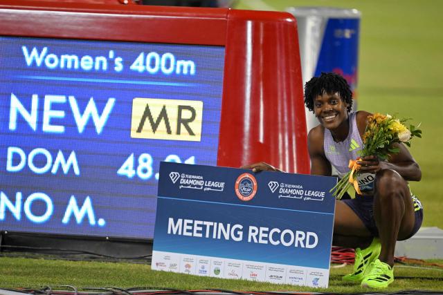 The Dominican Republic's Marileidy Paulino celebrates after setting a new meeting record in the women's 400m final during the IAAF Diamond League competition at Suheim Bin Hamad Stadium in Doha on June 19, 2026. (Photo by Mahmud HAMS / AFP)