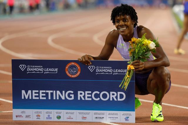 The Dominican Republic's Marileidy Paulino celebrates after setting a new meeting record in the women's 400m final during the IAAF Diamond League competition at Suheim Bin Hamad Stadium in Doha on June 19, 2026. (Photo by KARIM JAAFAR / AFP)
