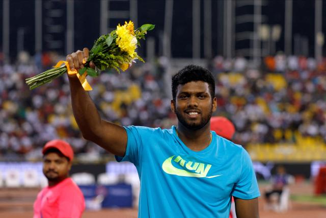 Sri Lanka's Rumesh Tharanga Pathirage celebrates winning the men's javelin throw final during the IAAF Diamond League competition at Suheim Bin Hamad Stadium in Doha on June 19, 2026. (Photo by KARIM JAAFAR / AFP)