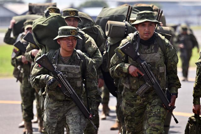 Indigenous soldiers from Ecuador's elite IWIAS unit arrive at Simon Bolivar Air Base in Guayaquil, Ecuador, on June 19, 2026, amid a state of emergency declared in 10 provinces. Ecuador's President Daniel Noboa declared a new state of emergency on June 17, 2026, in 10 of the country's 24 provinces amid a surge in violence by drug trafficking groups. (Photo by MARCOS PIN / AFP)
