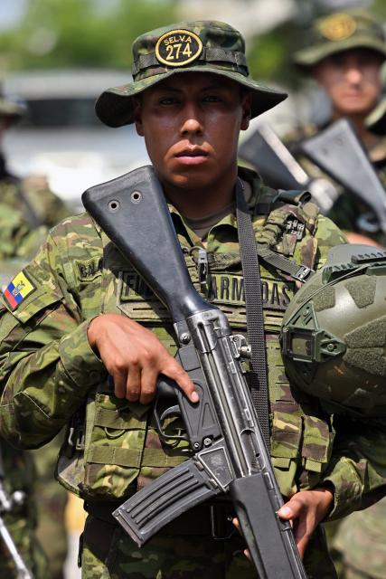 Indigenous soldiers from Ecuador's elite IWIAS unit arrive at Simon Bolivar Air Base in Guayaquil, Ecuador, on June 19, 2026, amid a state of emergency declared in 10 provinces. Ecuador's President Daniel Noboa declared a new state of emergency on June 17, 2026, in 10 of the country's 24 provinces amid a surge in violence by drug trafficking groups. (Photo by MARCOS PIN / AFP)