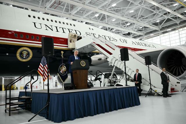 US President Donald Trump speaks in front of the new Air Force One, gifted to him by by Qatar, in a hangar at Joint Base Andrews in Maryland on June 19, 2026. White House officials bade farewell on June 18, 2026 to one of the two jets that have been used to transport US presidents for more than 30 years. The goodbye messages fueled speculation that a Boeing 747 controversially gifted to President Donald Trump by the Gulf emirate of Qatar is now due to enter service. Trump will be heading to Joint Base Andrews before spending the weekend at Camp David. (Photo by Brendan SMIALOWSKI / AFP)
