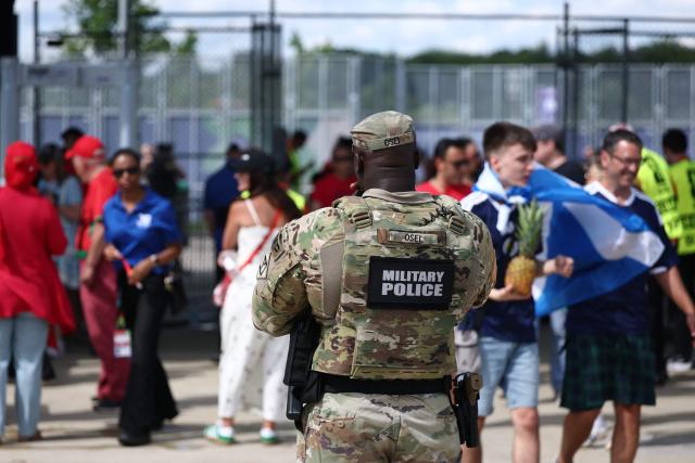 A member of the military police stands guard outside the venue ahead of the 2026 World Cup Group C football match between Scotland and Morocco at the Boston Stadium in Foxborough on June 19, 2026.  (Photo by FRANCK FIFE / AFP)