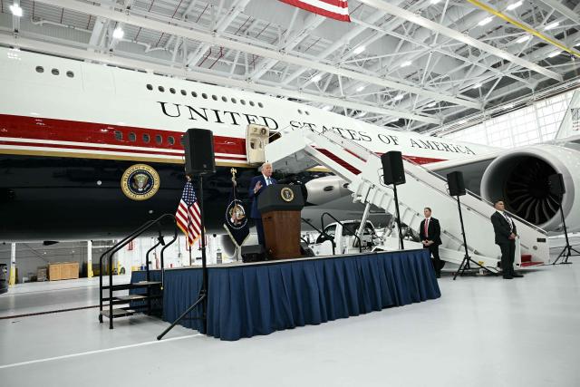 US President Donald Trump speaks in front of the new Air Force One, gifted to him by by Qatar, in a hangar at Joint Base Andrews in Maryland on June 19, 2026. White House officials bade farewell on June 18, 2026 to one of the two jets that have been used to transport US presidents for more than 30 years. The goodbye messages fueled speculation that a Boeing 747 controversially gifted to President Donald Trump by the Gulf emirate of Qatar is now due to enter service. Trump will be heading to Joint Base Andrews before spending the weekend at Camp David. (Photo by Brendan SMIALOWSKI / AFP)