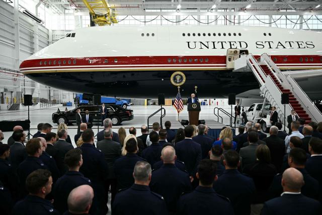 US President Donald Trump speaks in front of the new Air Force One, gifted to him by by Qatar, in a hangar at Joint Base Andrews in Maryland on June 19, 2026. White House officials bade farewell on June 18, 2026 to one of the two jets that have been used to transport US presidents for more than 30 years. The goodbye messages fueled speculation that a Boeing 747 controversially gifted to President Donald Trump by the Gulf emirate of Qatar is now due to enter service. Trump will be heading to Joint Base Andrews before spending the weekend at Camp David. (Photo by Brendan SMIALOWSKI / AFP)